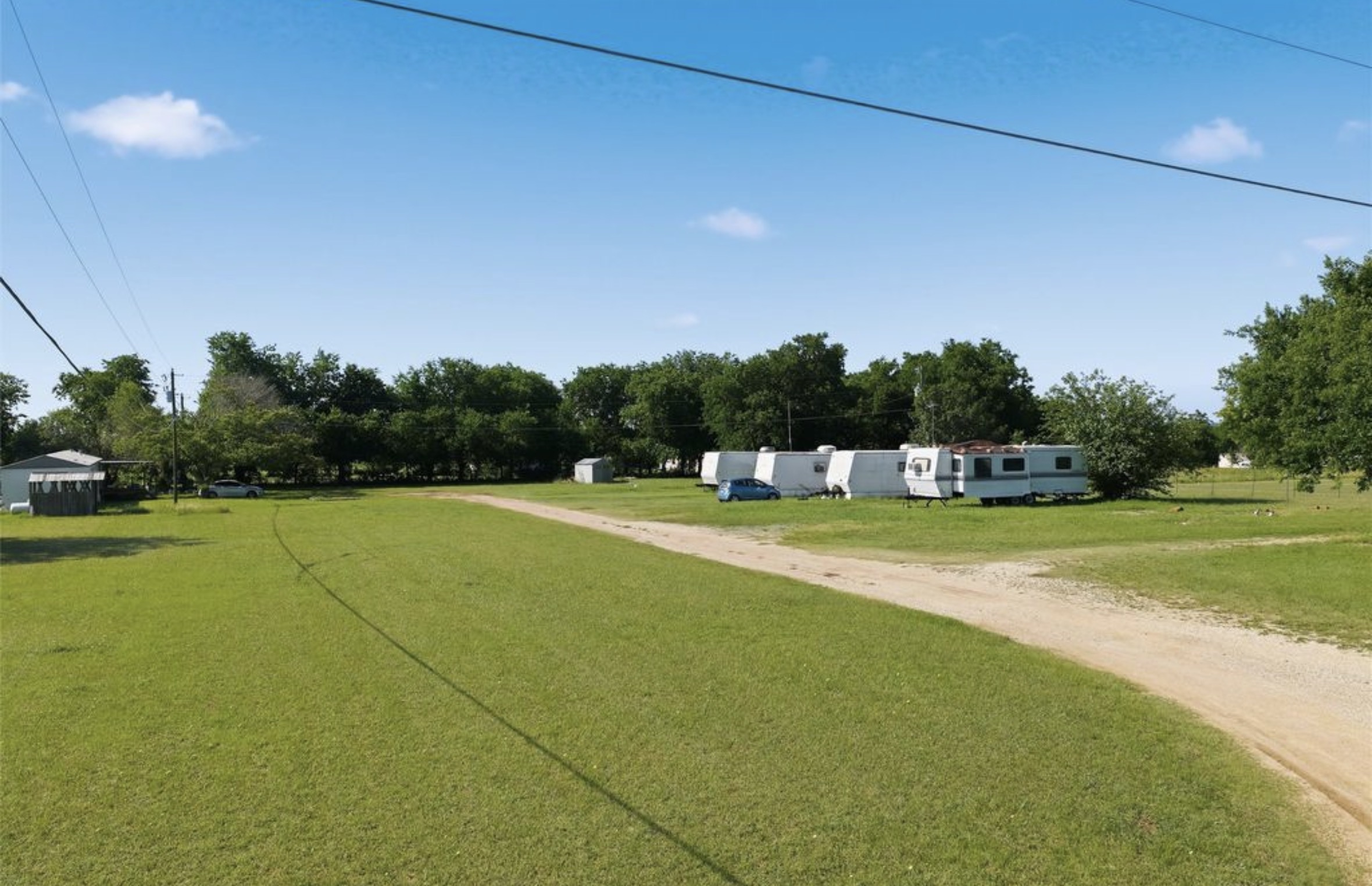 Spacious grassy sites at Franks Villa RV Park